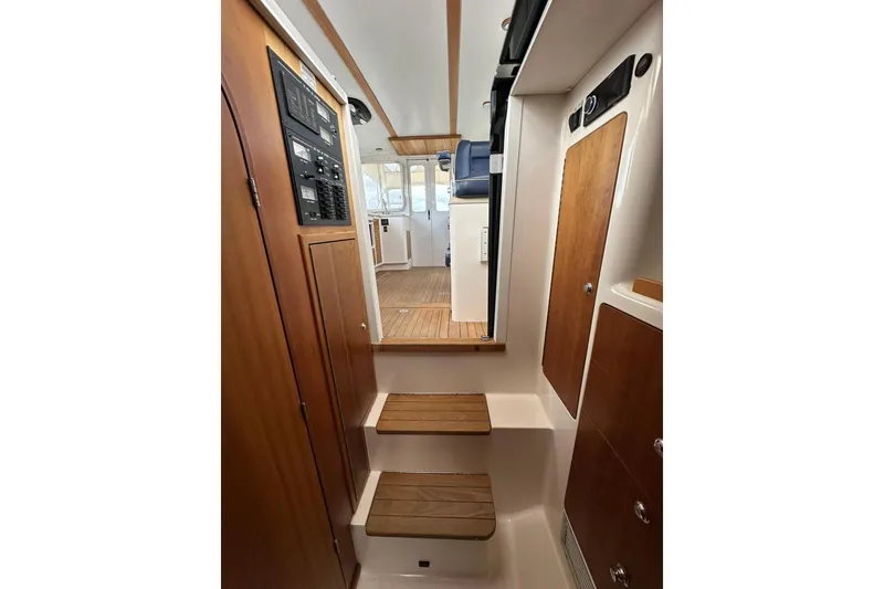 Slide: The Image of Interior of 2007 True North 38 Heritage boat with wooden steps and cabinetry. - 86