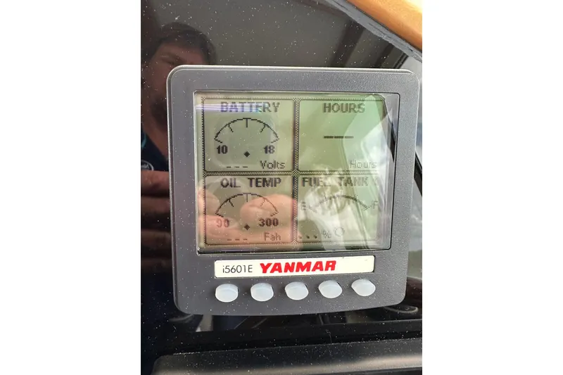 Slide: The Image of Yanmar engine display showing battery voltage, oil temperature, and fuel tank levels on a 2007 True North 38 Heritage. - 92