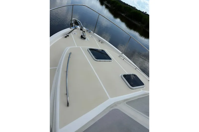 Slide: The Image of Bow view of 2007 True North 38 Heritage yacht on calm water. - 28