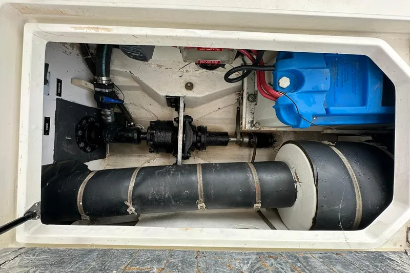 Slide: The Image of Engine compartment of 2007 True North 38 Heritage boat, showing mechanical components and wiring. - 25