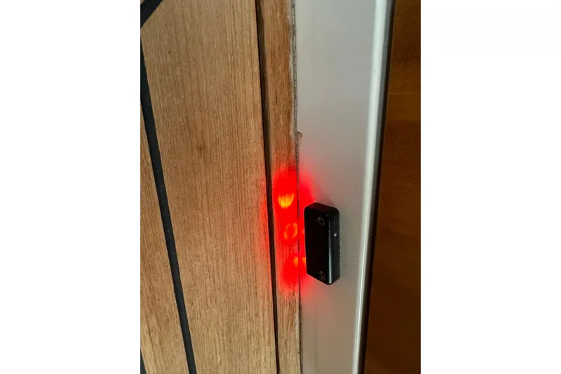 Slide: The Image of Red light indicator on wooden panel of 2007 True North 38 Heritage boat. - 106
