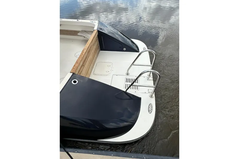 Slide: The Image of Stern view of 2007 True North 38 Heritage boat with swim platform and ladder. - 15