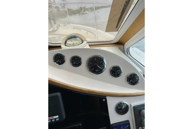Slide: The Image of Dashboard of 2007 True North 38 Heritage boat with gauges and compass. - 93