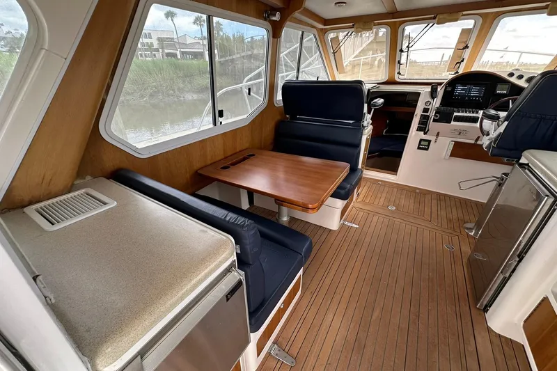 Slide: The Image of Interior of 2007 True North 38 Heritage boat with wood flooring and seating area. - 53