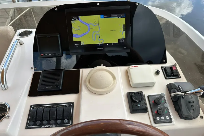 Slide: The Image of Control panel of a 2007 True North 38 Heritage boat with Garmin navigation system. - 41