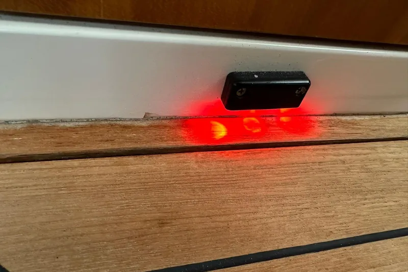 Slide: The Image of Red light indicator on wooden panel of 2007 True North 38 Heritage boat. - 103