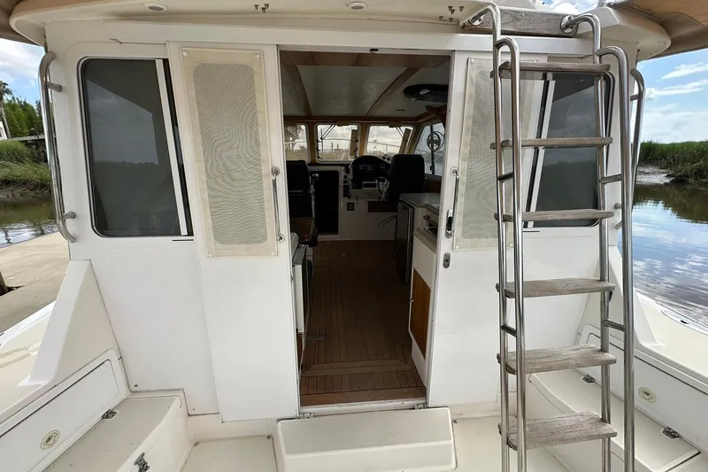 Slide: The Image of 2007 True North 38 Heritage boat interior with ladder and wooden flooring. - 51