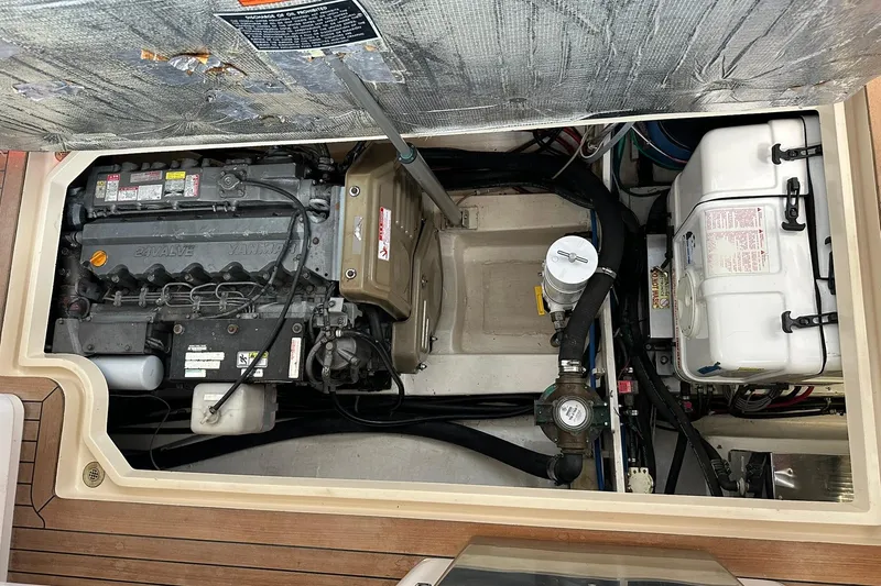 Slide: The Image of Engine compartment of a 2007 True North 38 Heritage boat, showcasing mechanical components. - 99