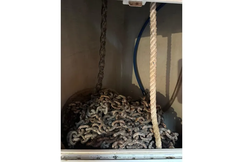 Slide: The Image of Rusty anchor chain and rope in a 2007 True North 38 Heritage boat compartment. - 116
