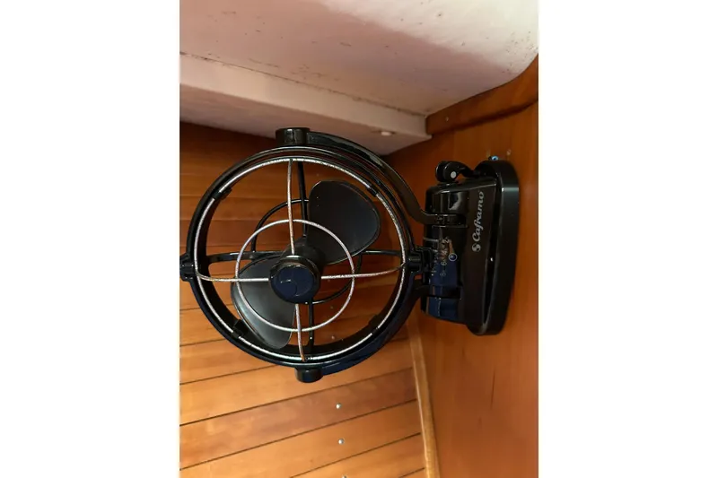 Slide: The Image of Wall-mounted fan inside 2007 True North 38 Heritage boat, featuring wooden paneling. - 85
