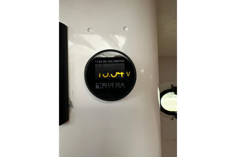 Slide: The Image of Blue Sea Systems voltmeter displaying 10.9 volts on True North 38 Heritage, 2007 model. - 79
