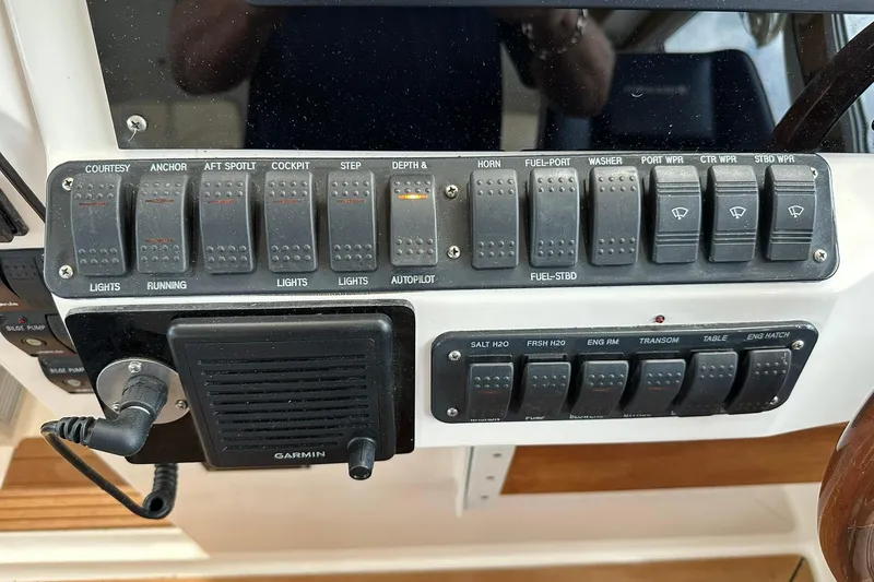 Slide: The Image of Control panel of a 2007 True North 38 Heritage boat with labeled switches. - 71