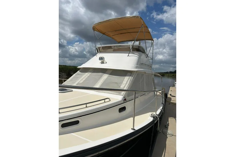 Slide: The Image of 2007 True North 38 Heritage yacht docked under cloudy skies. - 5