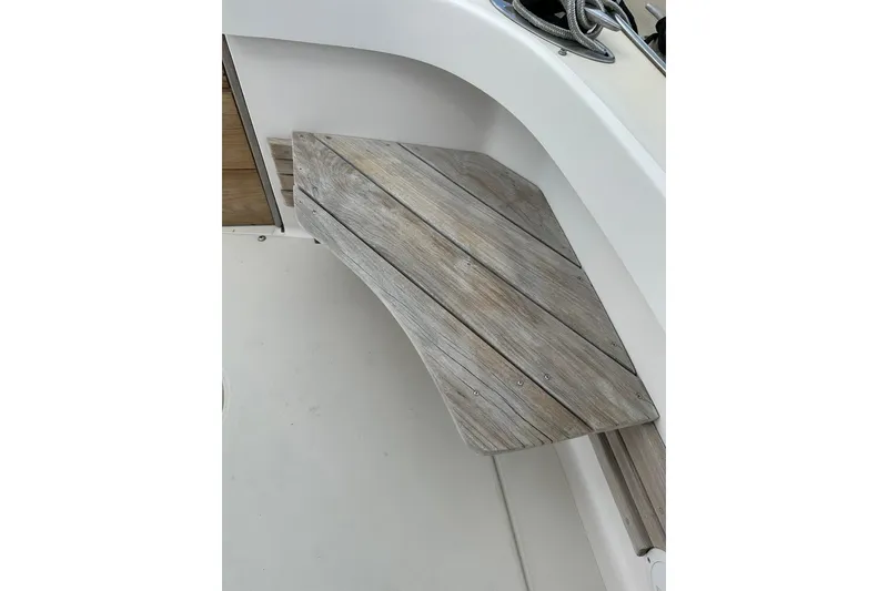 Slide: The Image of Wooden foldable table on a 2007 True North 38 Heritage boat deck. - 37
