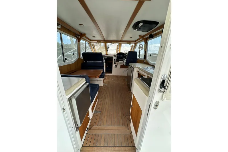 Slide: The Image of Interior of 2007 True North 38 Heritage boat with wood accents and seating. - 52