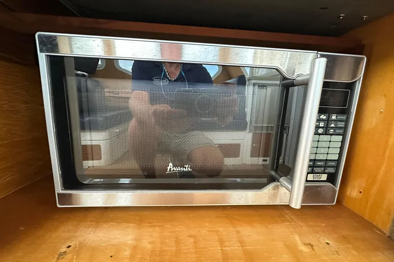 Slide: The Image of Avanti microwave in a 2007 True North 38 Heritage boat kitchen setting. - 63