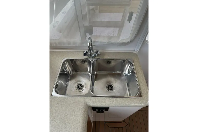 Slide: The Image of Stainless steel double sink in 2007 True North 38 Heritage boat kitchen. - 55