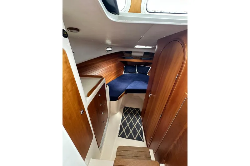 Slide: The Image of Interior of 2007 True North 38 Heritage yacht with wooden cabinetry and cozy sleeping area. - 74