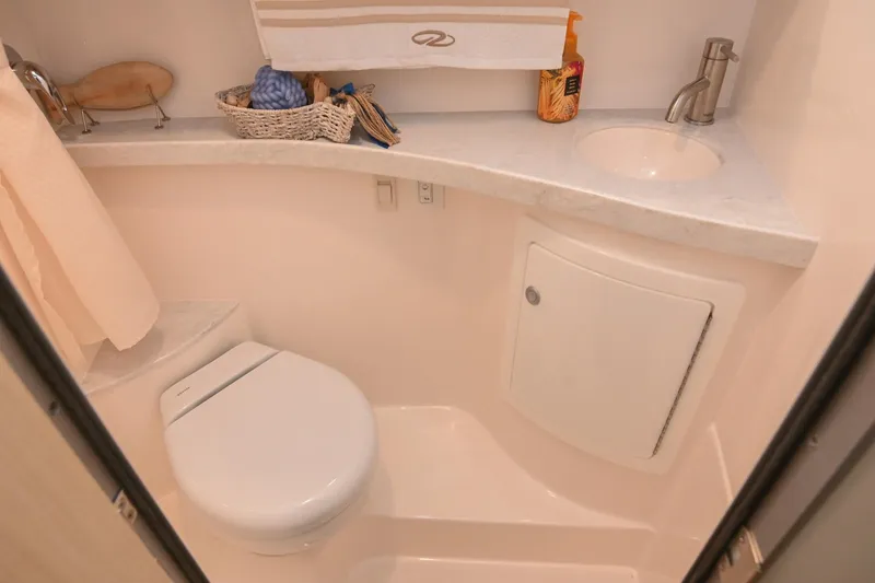 Slide: The Image of 2025 Regal 28 Express boat bathroom with modern fixtures and compact design. - 52