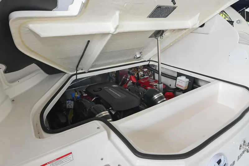 Slide: The Image of Open engine compartment of 2025 Regal 28 Express boat, showcasing internal components. - 53