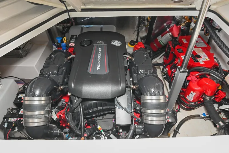 Slide: The Image of Engine compartment of 2025 Regal 28 Express boat featuring a Volvo Penta engine. - 55