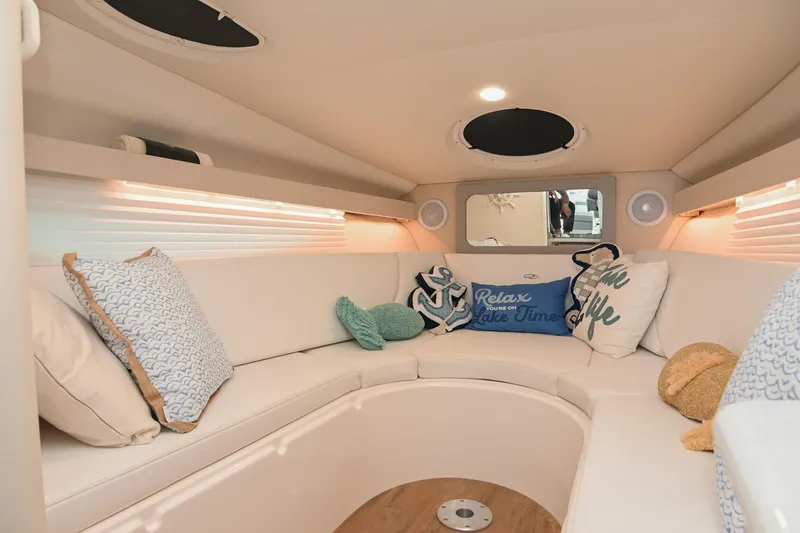 Slide: The Image of Luxurious interior of 2025 Regal 28 Express boat with cozy seating and decorative pillows. - 42