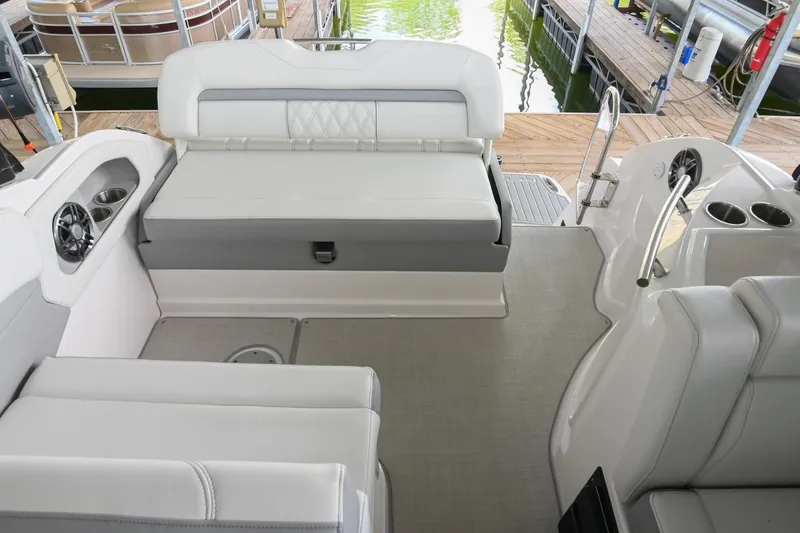 Slide: The Image of Interior of 2025 Regal 28 Express boat with white seating and modern design. - 14