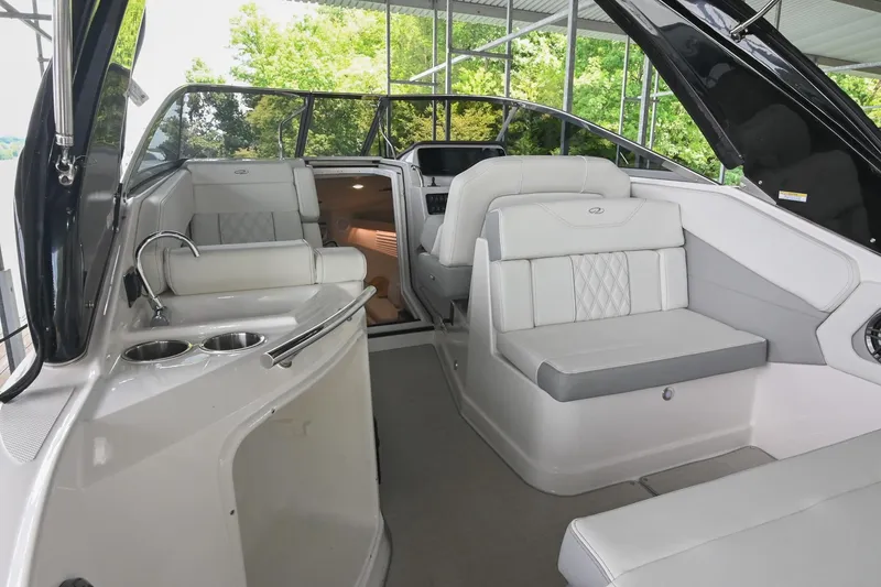 Slide: The Image of Interior of 2025 Regal 28 Express boat with luxurious seating and modern amenities. - 13