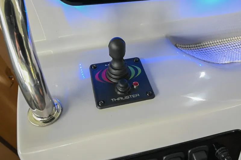 Slide: The Image of Joystick control for thruster on 2025 Regal 28 Express boat dashboard. - 28