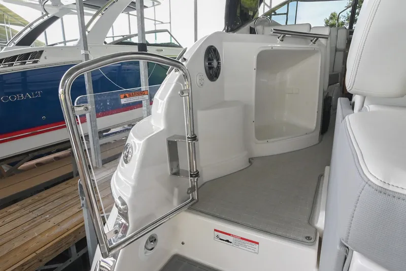 Slide: The Image of 2025 Regal 28 Express boat interior with open hatch and seating area. - 12