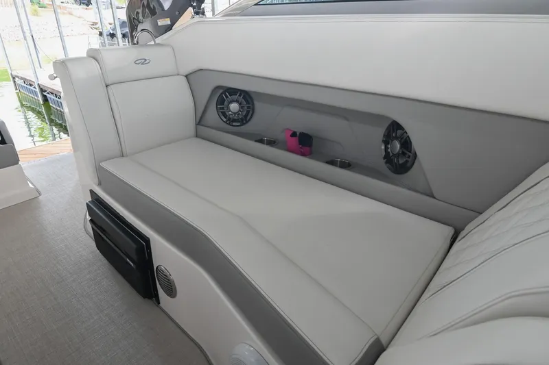 Slide: The Image of 2025 Regal 28 Express boat interior with white seating and built-in speakers. - 22