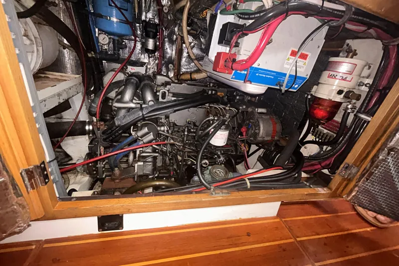 Slide: The Image of Engine compartment of a 1995 Freedom 45 CC sailboat, showcasing intricate wiring and components. - 18