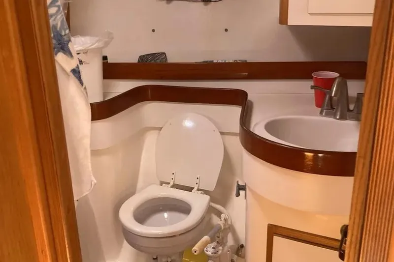 Slide: The Image of Compact bathroom in a 1995 Freedom 45 CC yacht, featuring a toilet and sink. - 8