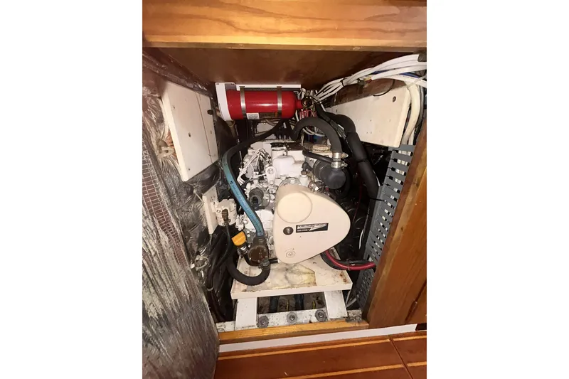 Slide: The Image of Engine compartment of a 1995 Freedom 45 CC sailboat, featuring a Northern Lights generator. - 17