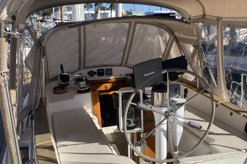 Slide: The Image of Cockpit of a 1995 Freedom 45 CC sailboat with steering wheel and navigation equipment. - 16