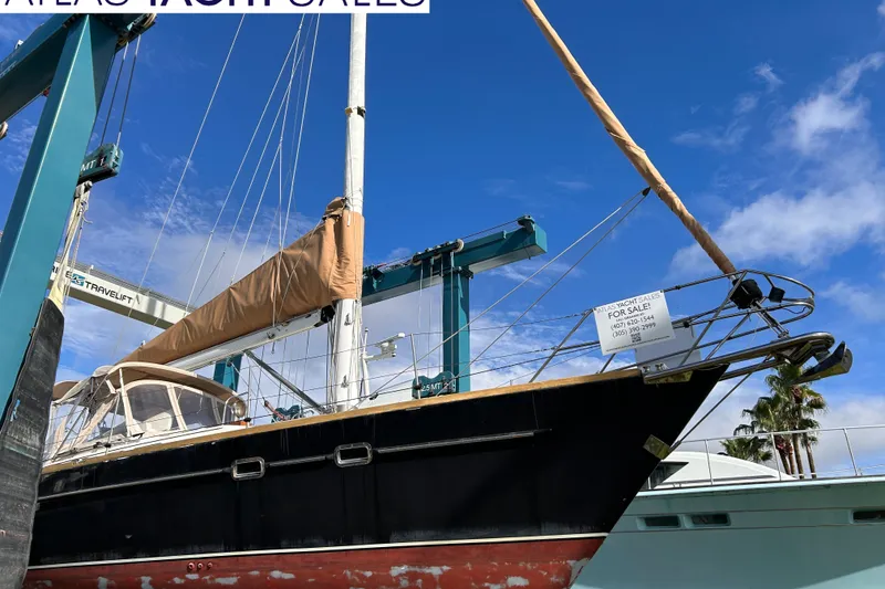 Slide: The Image of Sailboat Freedom 45 CC, 1995 model, for sale at marina under clear blue sky. - 18