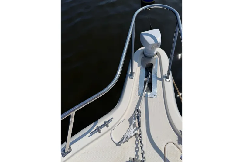 Slide: The Image of Bow of a 1998 Pursuit 2860 Denali boat with anchor chain and railing. - 15