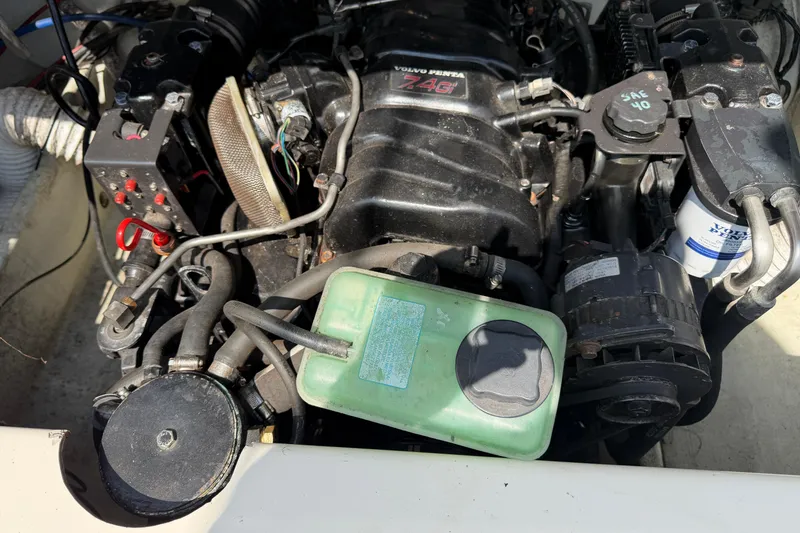 Slide: The Image of Engine compartment of a 1998 Pursuit 2860 Denali boat with Volvo Penta components. - 13