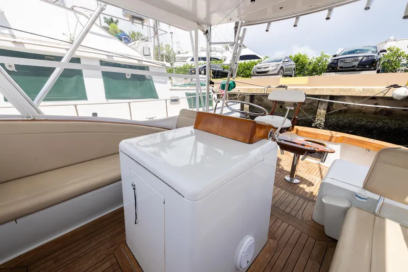 Slide: The Image of Interior of a 2001 Predator Express boat with seating and helm station. - 14