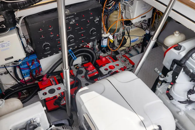 Slide: The Image of Engine room of a 2001 Predator Express boat with batteries and control panel. - 50