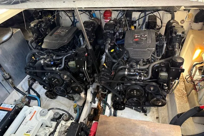 Slide: The Image of Engine compartment of a 2005 Sea Ray 300 Sundancer boat, showcasing dual engines. - 17