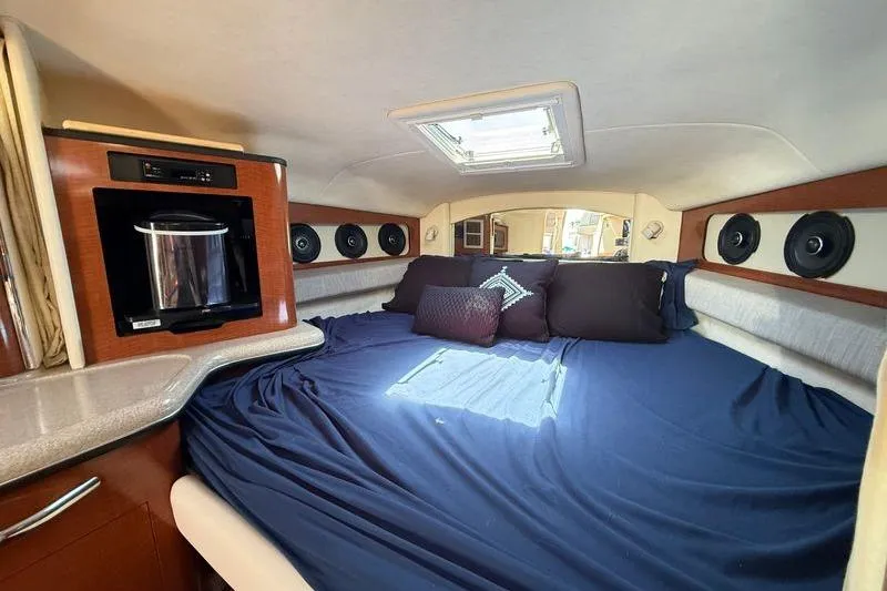 Slide: The Image of Interior cabin of 2005 Sea Ray 300 Sundancer with bed and skylight. - 13