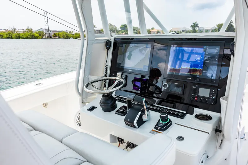 Slide: The Image of 2024 Freeman 34VH boat cockpit with advanced navigation and control systems. - 23
