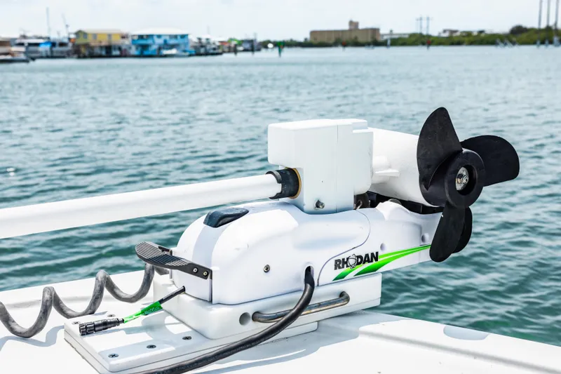 Slide: The Image of Rhodan trolling motor on Freeman 34VH boat, 2024 model, docked by the water. - 34