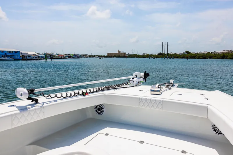 Slide: The Image of 2024 Freeman 34VH boat on calm water, featuring a spacious deck and modern equipment. - 18