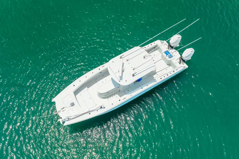 Slide: The Image of Aerial view of 2024 Freeman 34VH boat on turquoise water. - 14
