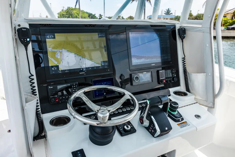 Slide: The Image of 2024 Freeman 34VH boat dashboard with navigation screens and controls. - 24