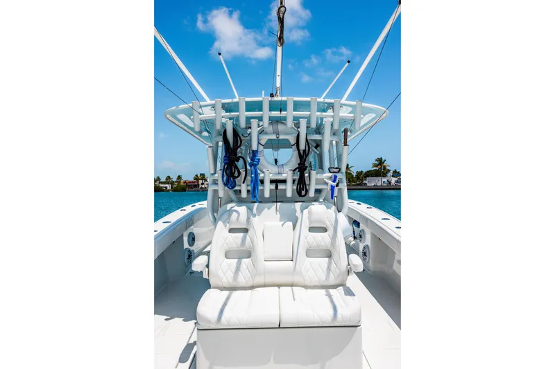 Slide: The Image of 2024 Freeman 34VH boat interior with white seating and fishing rod holders. - 32