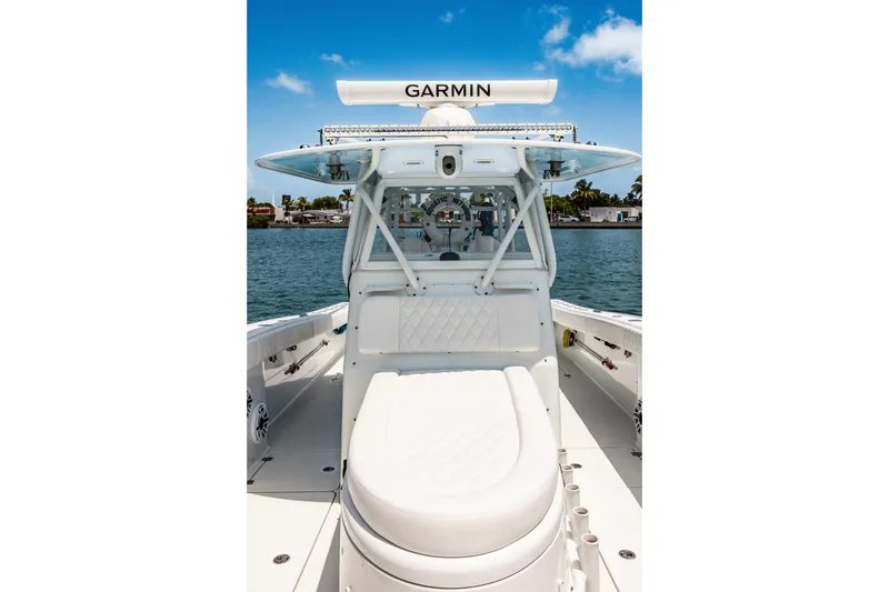 Slide: The Image of 2024 Freeman 34VH boat with Garmin equipment, docked on a sunny day. - 20