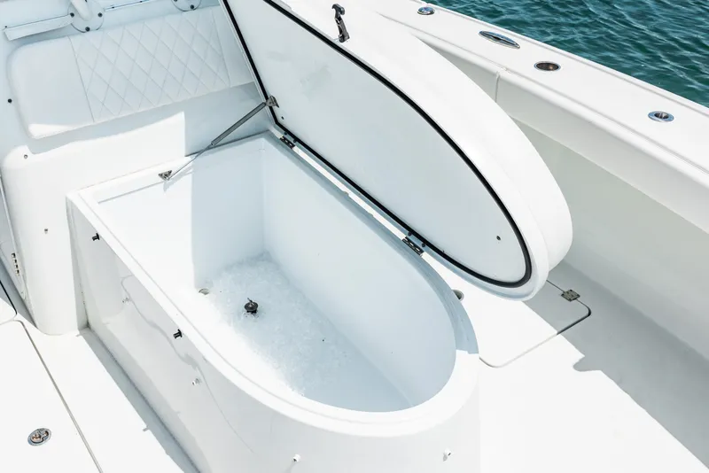 Slide: The Image of Open storage compartment on 2024 Freeman 34VH boat, featuring spacious interior and sleek design. - 39